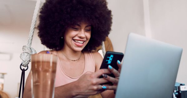 black-woman-phone-and-smile-for-good-news-social